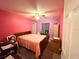 Bright bedroom features a ceiling fan, carpet, and pink and purple color scheme at 14 Dogwood Drive Radl, Ocala, FL 34472