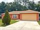 Charming one-story home with a spacious driveway and well-maintained lawn at 14 Dogwood Drive Radl, Ocala, FL 34472