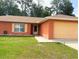 Charming single-story home featuring a well-maintained lawn and a two-car garage at 14 Dogwood Drive Radl, Ocala, FL 34472