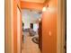 Hallway with tile flooring leading to multiple rooms, showcasing the home's layout at 14 Dogwood Drive Radl, Ocala, FL 34472