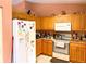 Kitchen featuring essential appliances, tile flooring, and generous cabinet space at 14 Dogwood Drive Radl, Ocala, FL 34472