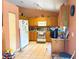 Well-lit kitchen featuring tile flooring, wooden cabinets, and modern appliances at 14 Dogwood Drive Radl, Ocala, FL 34472