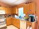 Functional kitchen featuring ample cabinetry, tile flooring, and essential appliances at 14 Dogwood Drive Radl, Ocala, FL 34472