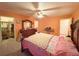 Spacious main bedroom featuring carpet, ceiling fan, and closet at 14 Dogwood Drive Radl, Ocala, FL 34472