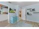 Cozy bedroom with blue walls, modern furniture, floating shelves, and hardwood floors at 14330 Sw 79Th Ter, Ocala, FL 34473