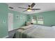 Serene bedroom with a plush bed, calming color scheme, and bright windows creating a relaxing retreat at 14330 Sw 79Th Ter, Ocala, FL 34473
