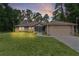 Beautiful single-Gathering home with an expansive lawn, attached garage, and lush landscaping at 14330 Sw 79Th Ter, Ocala, FL 34473