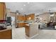 Spacious kitchen boasts ample counter space, wooden cabinets, and modern appliances at 14330 Sw 79Th Ter, Ocala, FL 34473