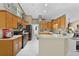 Bright kitchen with wooden cabinets and modern appliances, perfect for cooking and gatherings at 14330 Sw 79Th Ter, Ocala, FL 34473