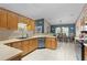 Well-appointed kitchen featuring wooden cabinets, stainless steel appliances, and adjacent dining area at 14330 Sw 79Th Ter, Ocala, FL 34473