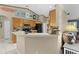 Charming kitchen features wooden cabinets and a convenient breakfast bar, great for entertaining at 14330 Sw 79Th Ter, Ocala, FL 34473