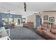 Open living room area with an office, and nice seating, with lots of space at 14330 Sw 79Th Ter, Ocala, FL 34473