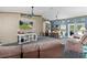 Spacious living room area with seating, tv, and office space at 14330 Sw 79Th Ter, Ocala, FL 34473
