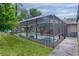 A serene screened pool area with inviting lounge seating and a refreshing pool at 14330 Sw 79Th Ter, Ocala, FL 34473