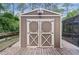 Well-maintained shed with double doors, perfect for storage and outdoor projects at 14330 Sw 79Th Ter, Ocala, FL 34473