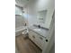 Bathroom featuring granite countertops, new fixtures, and tile tub at 14415 Sw 21St Pl, Ocala, FL 34481