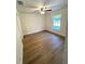 Bedroom featuring wood-look floors and a window for natural light at 14415 Sw 21St Pl, Ocala, FL 34481