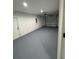 The garage features a concrete floor and a metal garage door at 14415 Sw 21St Pl, Ocala, FL 34481