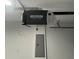 Installed LiftMaster garage door opener with all parts attached, and electrical panel beneath at 14415 Sw 21St Pl, Ocala, FL 34481