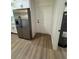 Kitchen space including stainless steel fridge, white cabinets, and modern appliances at 14415 Sw 21St Pl, Ocala, FL 34481