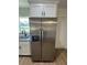 Spacious kitchen with stainless steel refrigerator and granite countertops at 14415 Sw 21St Pl, Ocala, FL 34481
