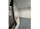 Utility room featuring flooring, a door, a water heater, and HVAC at 14415 Sw 21St Pl, Ocala, FL 34481