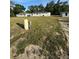 Well and equipment in backyard view on a large grassy lot at 14425 Sw 21St Pl, Ocala, FL 34481