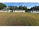 Sprawling backyard view showcases the property's well-maintained lawn at 14425 Sw 21St Pl, Ocala, FL 34481