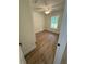 Bedroom with natural light, wood-look flooring and ceiling fan at 14425 Sw 21St Pl, Ocala, FL 34481