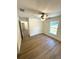 Spacious bedroom with ample closet space, ceiling fan, and wood-look flooring throughout at 14425 Sw 21St Pl, Ocala, FL 34481