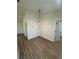 Dining area featuring wood-look floors, neutral walls, and contemporary light fixture at 14425 Sw 21St Pl, Ocala, FL 34481