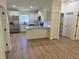 Updated kitchen features stainless steel appliances, granite countertops, and white cabinets at 14425 Sw 21St Pl, Ocala, FL 34481