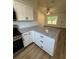Kitchen island featuring granite countertops and undermount cabinets with stainless steel appliances at 14425 Sw 21St Pl, Ocala, FL 34481