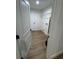 This laundry room includes hookups, wire rack and wood-look vinyl floors at 14425 Sw 21St Pl, Ocala, FL 34481