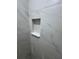 Shower niche in new light grey tiled shower at 14425 Sw 21St Pl, Ocala, FL 34481