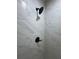 Close up of new black fixtures in shower with light grey tile at 14425 Sw 21St Pl, Ocala, FL 34481