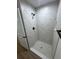 New tiled shower with black shower head and matching fixtures at 14425 Sw 21St Pl, Ocala, FL 34481