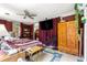 Inviting bedroom with traditional decor, complete with a large wardrobe and cozy bedding at 17150 Se 168Th Ter, Weirsdale, FL 32195