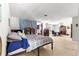 Open bedroom featuring natural light, with a sleeping area and separate space with desk and bookshelves at 17150 Se 168Th Ter, Weirsdale, FL 32195