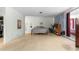 Bright bedroom featuring a bed, desk area, and sliding glass doors to the outdoors at 17150 Se 168Th Ter, Weirsdale, FL 32195
