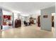 Open-concept space with a glimpse into bedroom and featuring a dining area, offering versatile living at 17150 Se 168Th Ter, Weirsdale, FL 32195