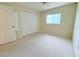Bedroom features carpet, ample natural light and closet at 17574 Se 95Th Ct, Summerfield, FL 34491