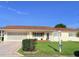 Charming single-story home featuring a well-maintained front yard and attached two-car garage at 17574 Se 95Th Ct, Summerfield, FL 34491