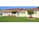 Charming single-story home featuring a well-maintained front yard with updated garage doors at 17574 Se 95Th Ct, Summerfield, FL 34491