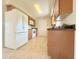 Functional kitchen with classic cabinetry and efficient appliance layout at 17574 Se 95Th Ct, Summerfield, FL 34491