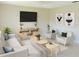 Comfortable living room with modern furniture, decorative art, and a large television at 17574 Se 95Th Ct, Summerfield, FL 34491
