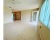 Bright and airy living room featuring neutral walls, tiled floors and access to the front door at 17574 Se 95Th Ct, Summerfield, FL 34491