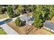 Single-story home with a modern gray roof, complemented by lush trees and spacious front and back yards at 1812 Se 38Th Ave, Ocala, FL 34471