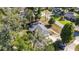 Aerial shot of home with lush landscaping, driveway, and quiet residential neighborhood at 1812 Se 38Th Ave, Ocala, FL 34471