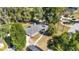 Inviting single-story home surrounded by mature trees, featuring a well-kept yard, long drive, and modern gray roof at 1812 Se 38Th Ave, Ocala, FL 34471